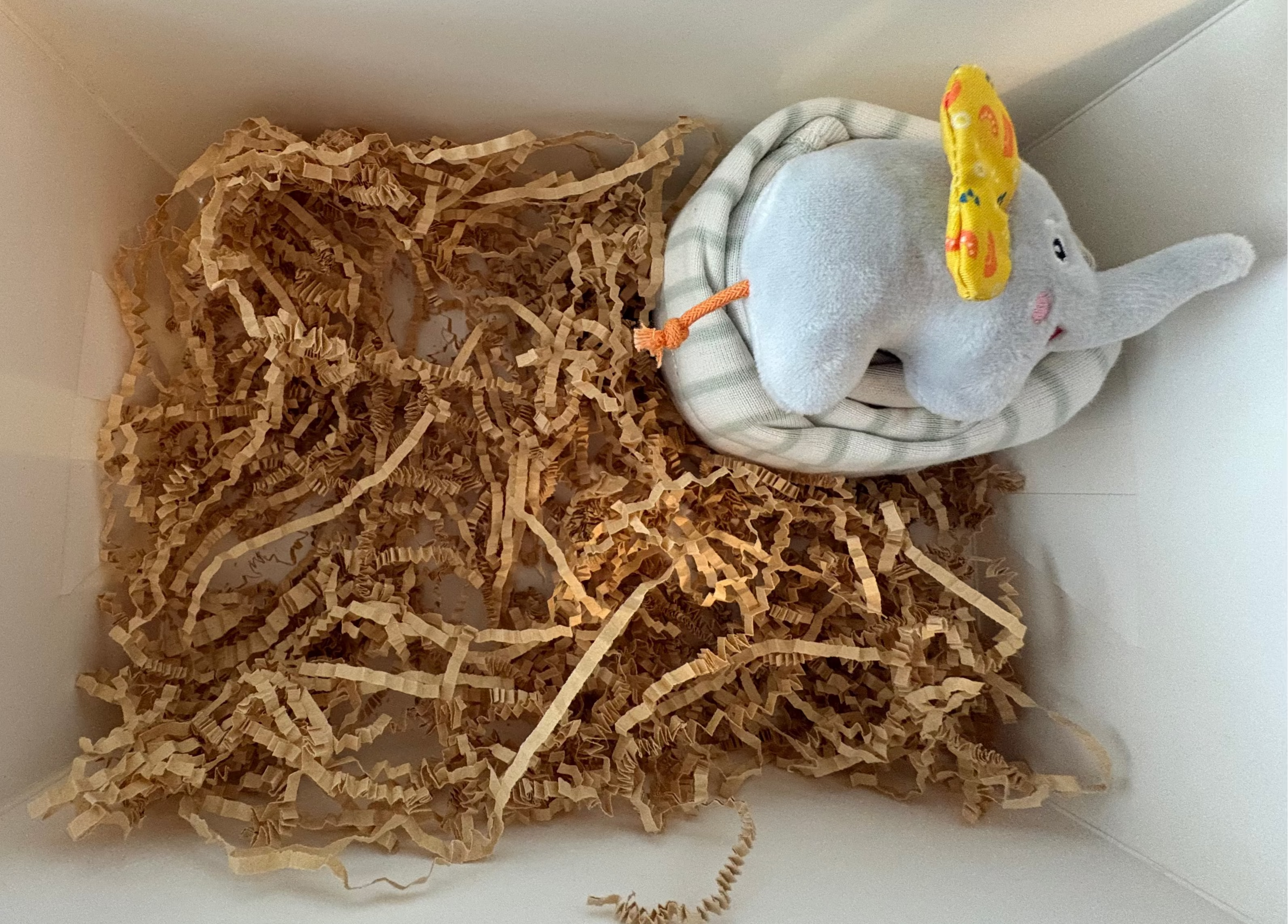 Small hand rattle elephant, one sage onesie and white and sage green stripped onesie